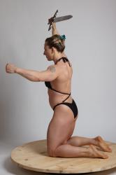 KAROLINA KNEELING WITH SWORD